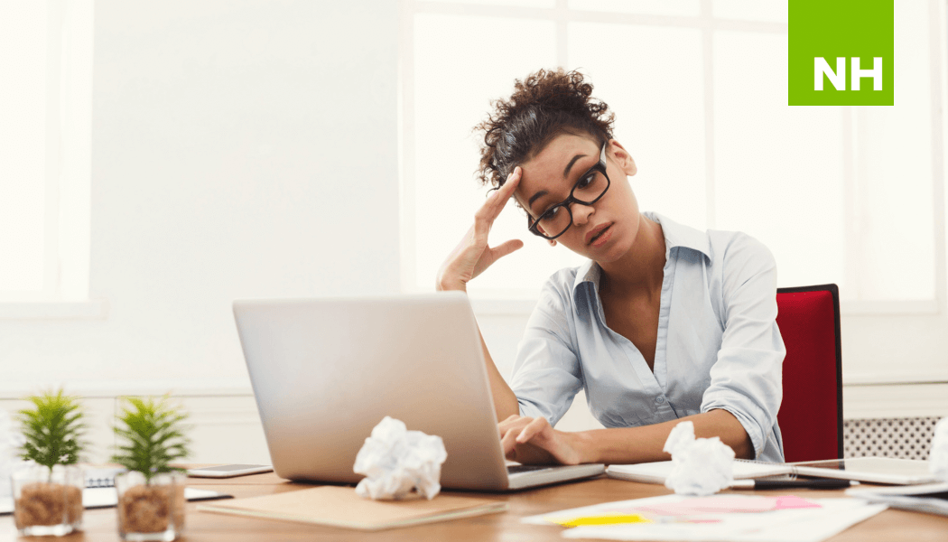 Frustrated woman sitting at desk