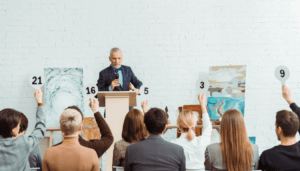 Auctioneer and audience at a fundraising event